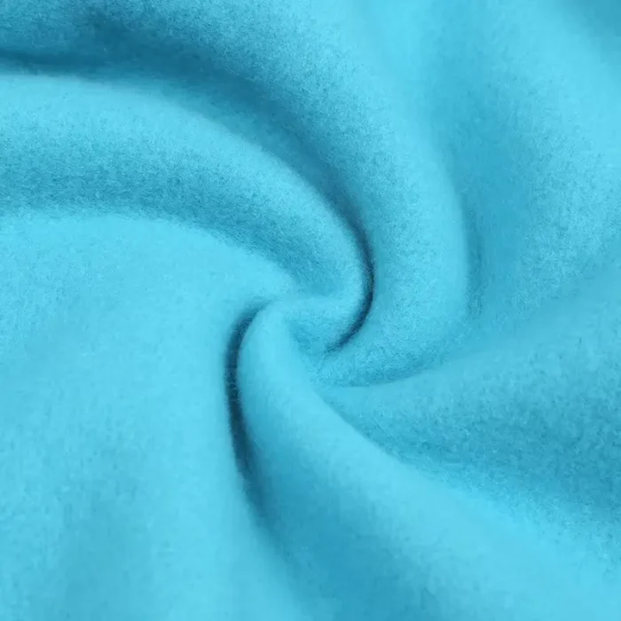 Close-up of premium baby joggers fabric, featuring ultra-soft 100% cotton French Terry, high-density breathable fleece, and vibrant eco-friendly dyeing. Professional infant apparel textile from a leading clothing manufacturer.