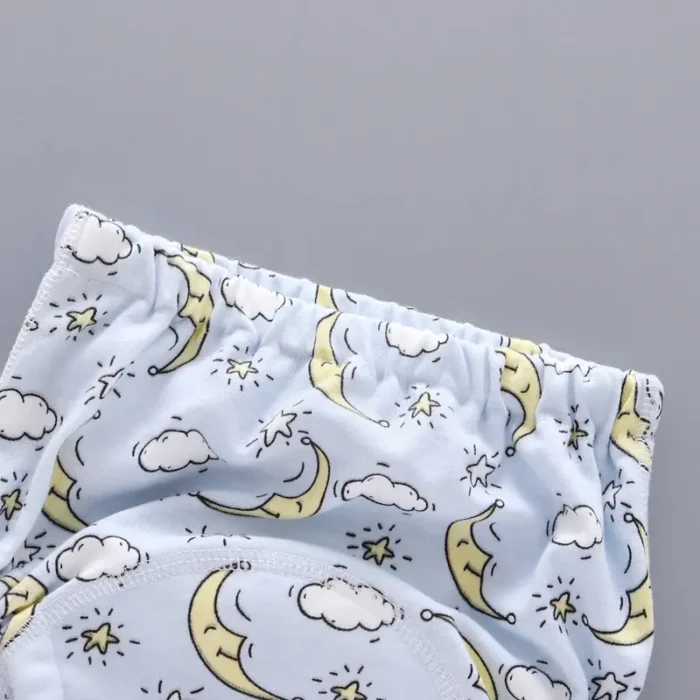 Detail of custom baby training pants waistband, featuring soft high-elasticity rubber band, cute moon and cloud eco-friendly print, premium skin-friendly infant innerwear from a professional OEM/ODM manufacturer.