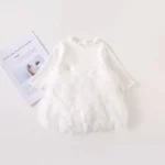 Custom white baby gala dress, featuring a unique faux-feather textured skirt, long sleeves, and ethereal voluminous silhouette. Premium infant girl's christening and occasion wear from a professional OEM/ODM clothing manufacturer.