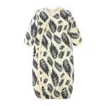 Custom baby kimono sleep gown, featuring a modern black and white palm leaf print, long sleeves, and convenient side-snap closures. High-quality infant sleepwear from a professional OEM/ODM clothing manufacturer.