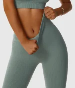 Sage green ribbed yoga leggings with high elasticity, produced by a professional OEM/ODM activewear manufacturer.