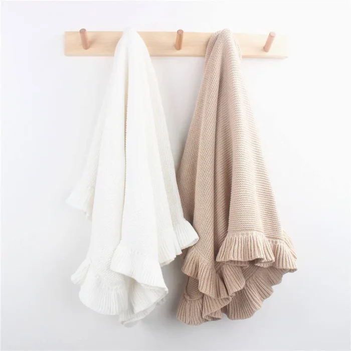 Ruffle trim baby blankets in cream and tan from a baby blankets factory in China.