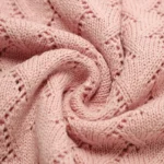 Close-up of a knitted baby blanket from a high-quality baby blankets manufacturer.
