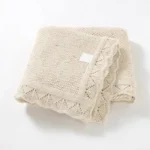 Beige scalloped edge baby blanket from an OEM baby blankets factory.