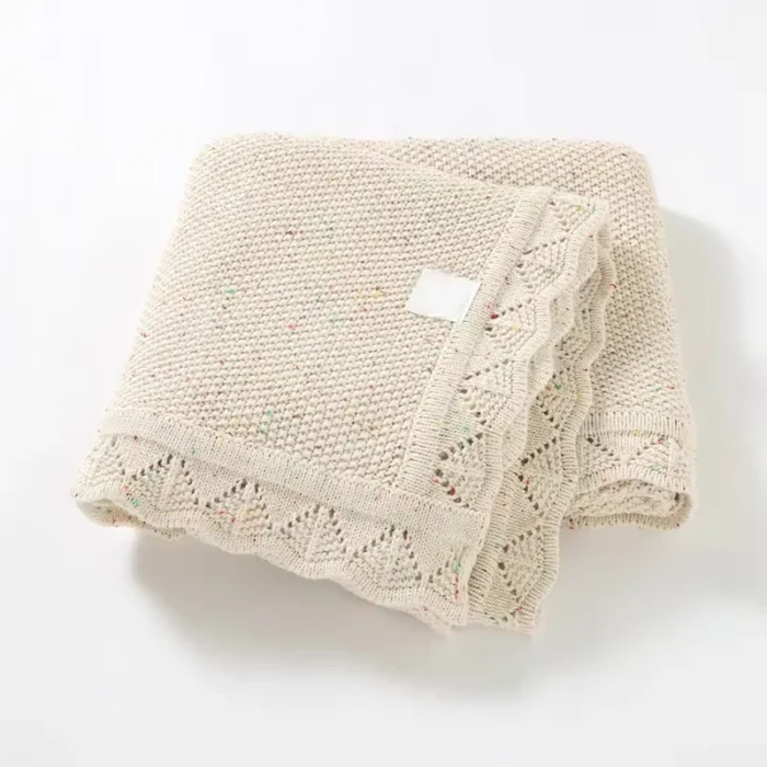 Beige scalloped edge baby blanket from an OEM baby blankets factory.