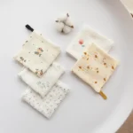 A set of patterned baby washcloths with fruit and floral prints, made of soft natural cotton by a China manufacturer.
