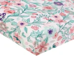 Close-up of high-quality floral crib sheets from an OEM crib sheets factory in China showing fabric texture.