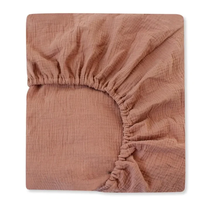 Solid terracotta muslin crib sheet from a professional crib sheets manufacturer in China.