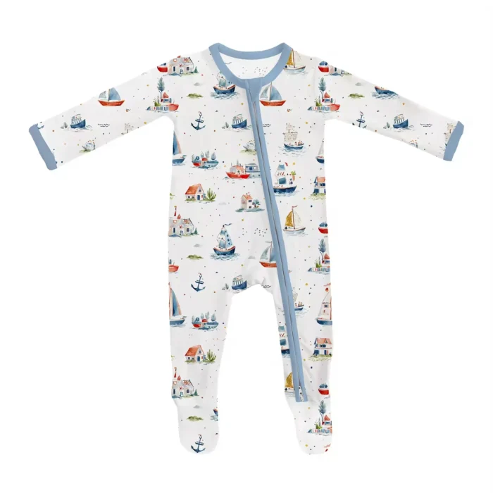Custom baby footie sleepsuit, featuring a whimsical nautical sailboat print, a convenient diagonal two-way zipper, and integrated footmuffs. High-quality infant sleepwear from a professional OEM/ODM clothing manufacturer.