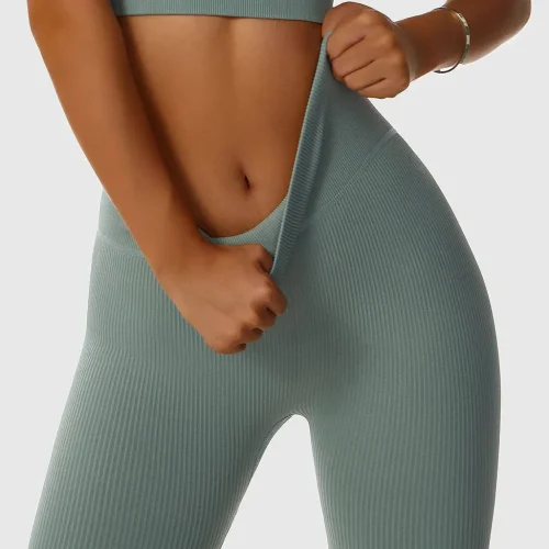 Sage green ribbed yoga leggings with high elasticity, produced by a professional OEM/ODM activewear manufacturer.
